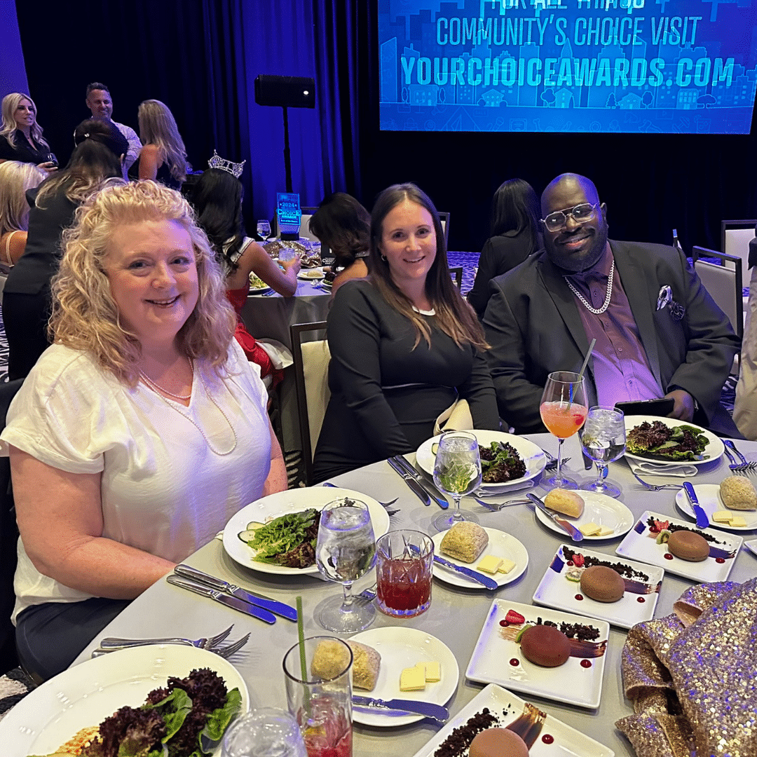 First Impression Ironworks team members sitting around a table at the Best of the Desert Awards cerimony.